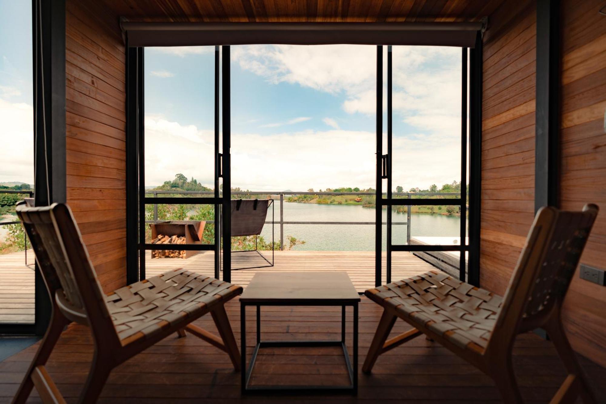 The Boato Hotel Guatapé Exteriör bild View from the interior of a floating cabin