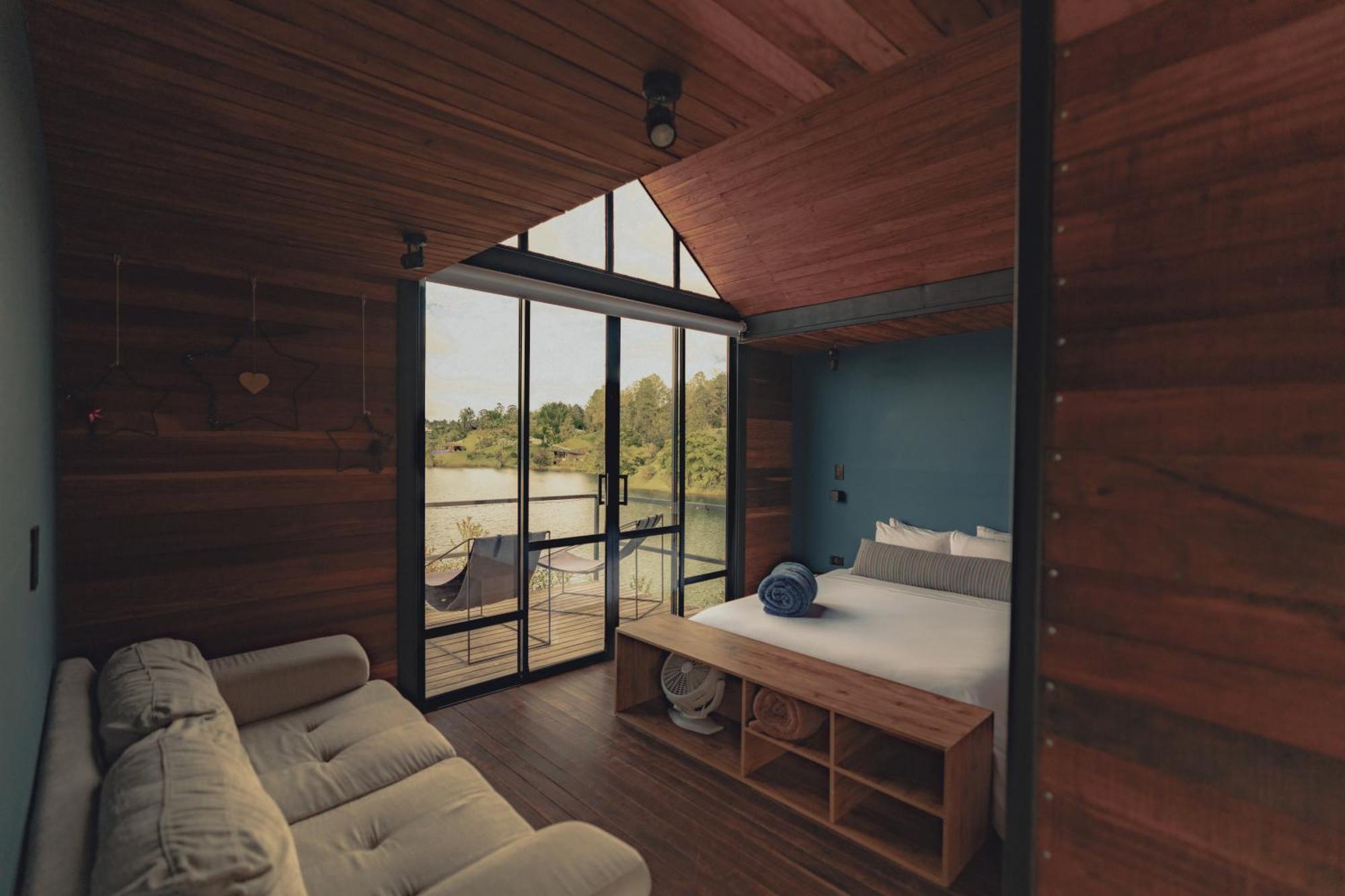 The Boato Hotel Guatapé Exteriör bild Interior of a cabin